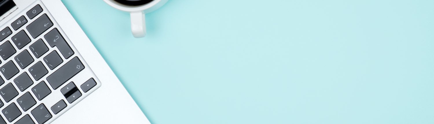 Colored office desk table with computer. Top view with copy space Laptop on Desk